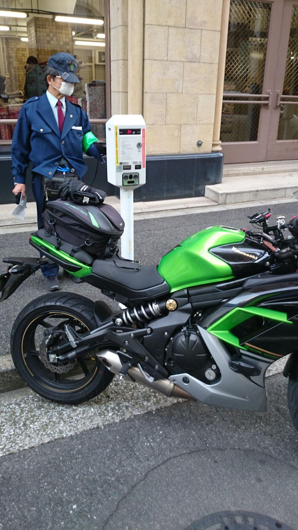 Parking meters, motorcycles and parking monitors