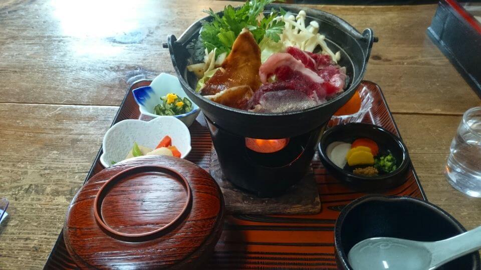 set meal served in a pot with boar meat and vegetables