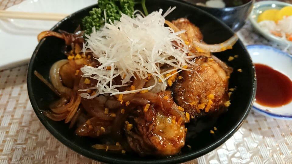 bowl of rice topped with oyster and hippopotamus